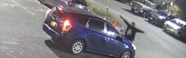 A screenshot from private surveillance footage provided by the Seattle Police Department shows a suspect engaging with the occupants of a vehicle on Feb. 9, 2021, in Seattle. The suspect shot the vehicle’s two occupants, one fatally, before he was killed by police. File photo