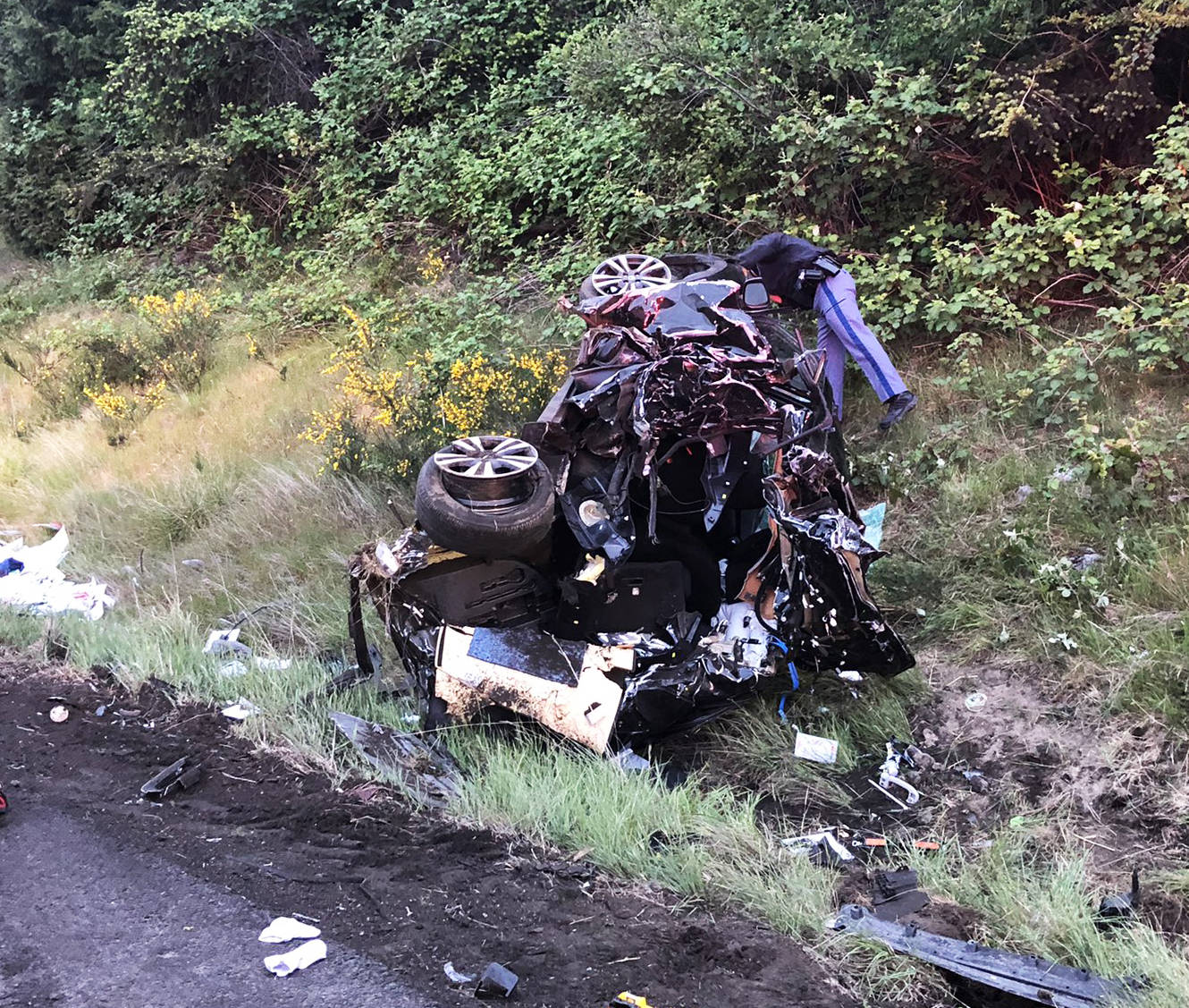 The female driver in this vehicle suffered serious injuries Thursday morning, May 20 after her car was struck by a box truck along the shoulder of northbound Interstate 5 in Kent near State Route 516. COURTESY PHOTO, South King Fire & Rescue
