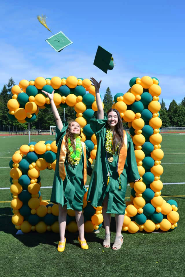 Two Kentridge High School graduates celebrate June 19 at the school. COURTESY PHOTO, Kentridge Facebook page