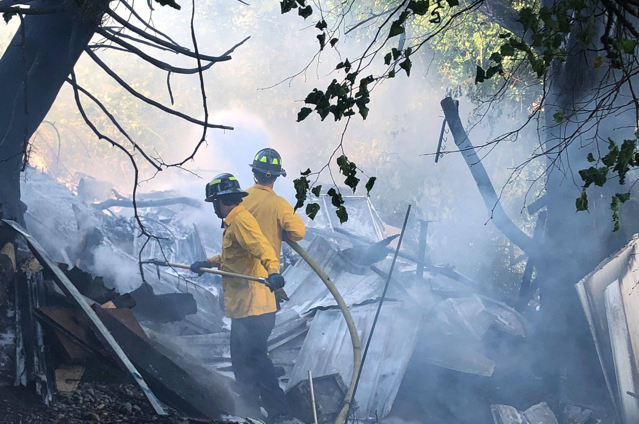 Firefighters take on a fire June 29 at a homeless camp along Frager Road in Kent, about 1 mile south of Meeker Street. COURTESY PHOTO, Puget Sound Fire