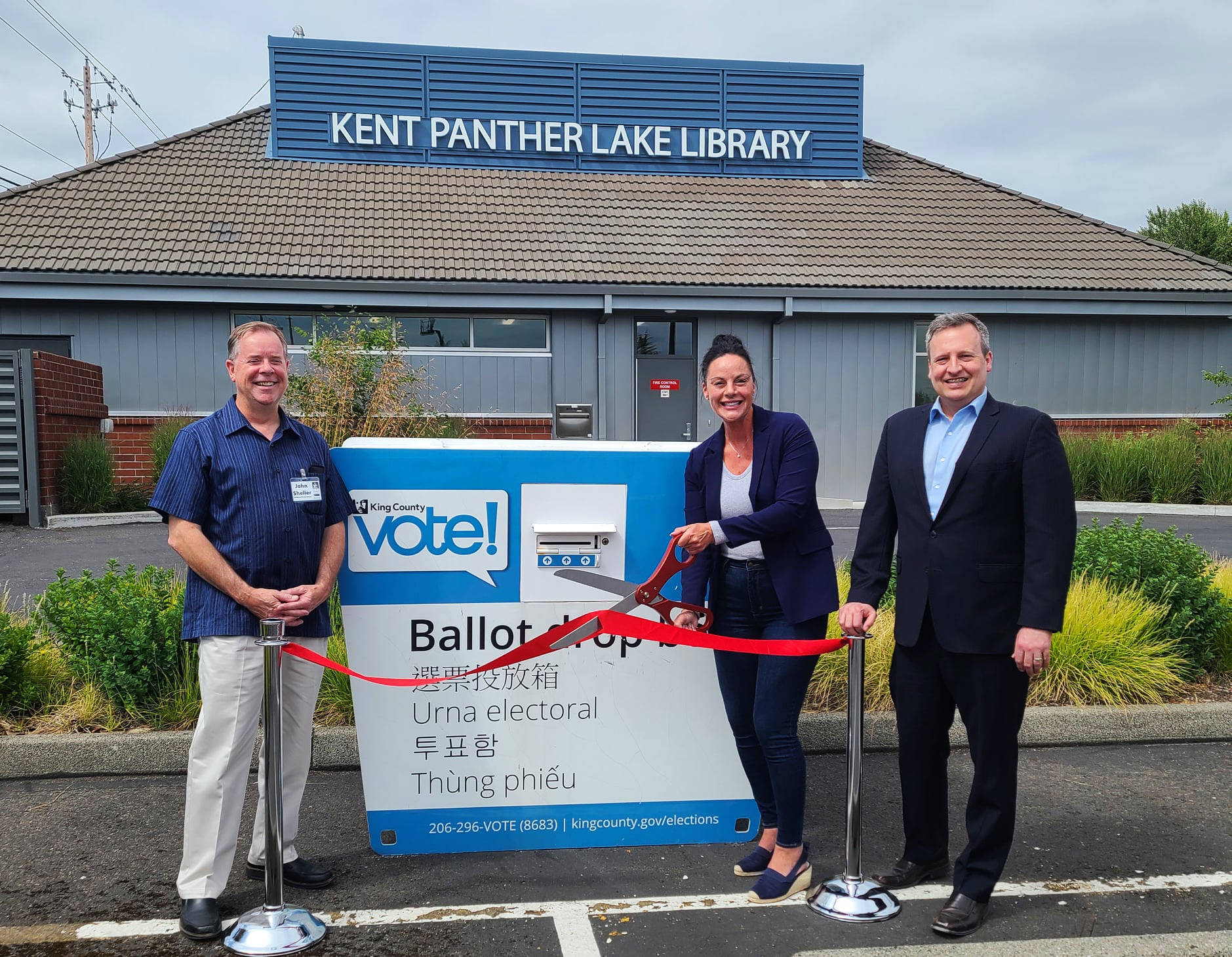 John Sheller with King County Library System, director Julie Wise of King County Elections and King County Councilmember Dave Upthegrove celebrate July 15 bringing a ballot box to the Panther Lake Library in Kent. COURTESY PHOTO, King County Elections