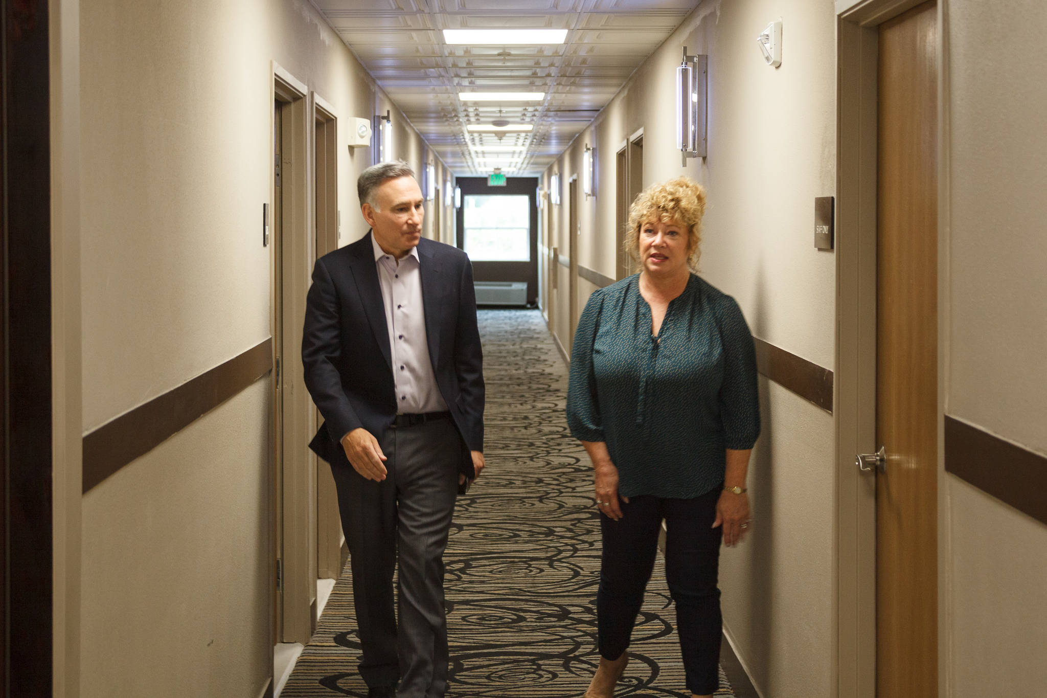 King County Executive Dow Constantine and Auburn Mayor Nancy Backus tour the Clarion Hotel in Auburn on Tuesday, July 20. The hotel will be used to house approximately 100 people experiencing homelessness in the area as part of the county’s Health Through Housing program. Photo by Henry Stewart-Wood/Auburn Reporter