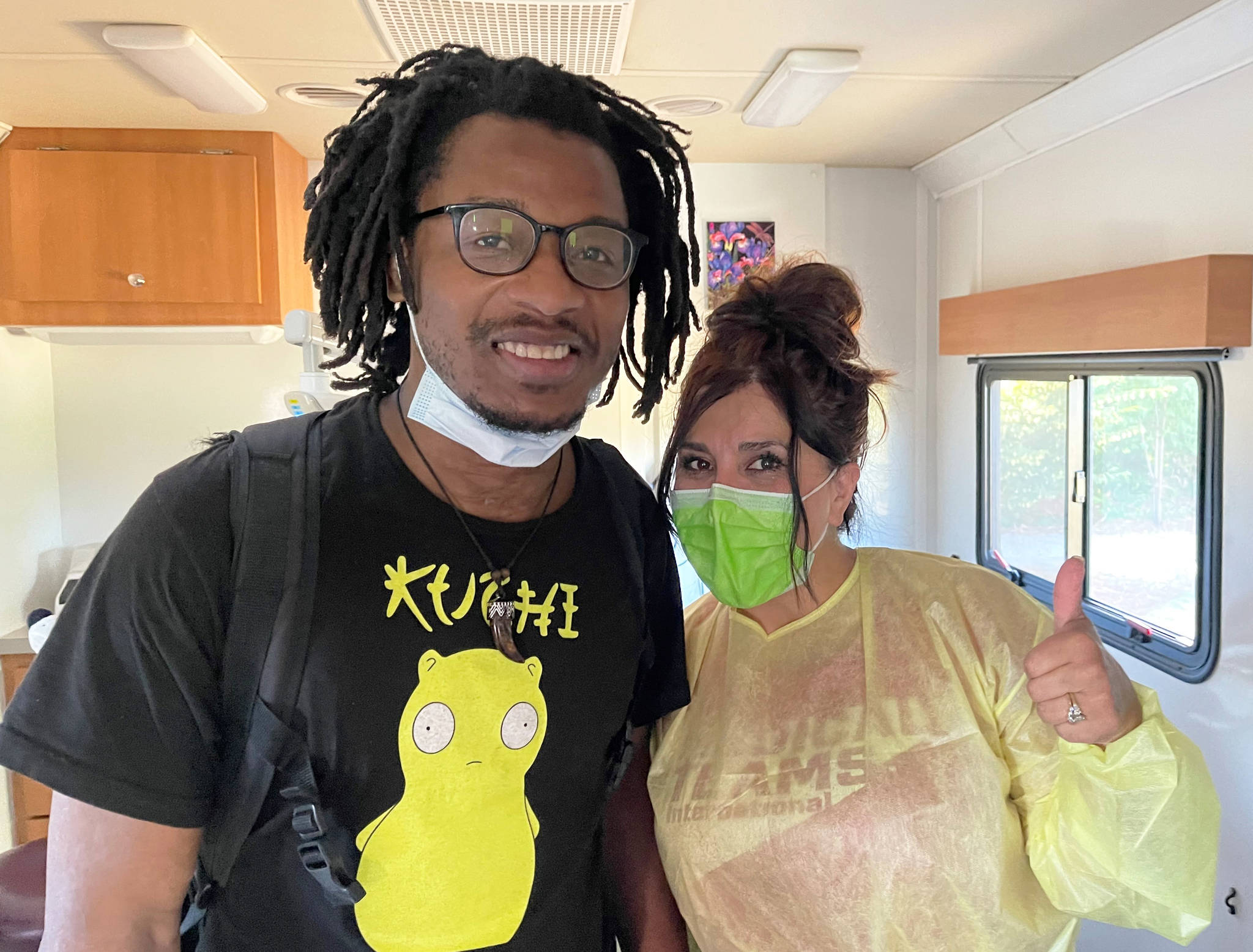 A homeless man shows off his new smile after receiving dental treatment at a free temporary clinic Aug. 6 in Kent. COURTESY PHOTO, Tubman Center