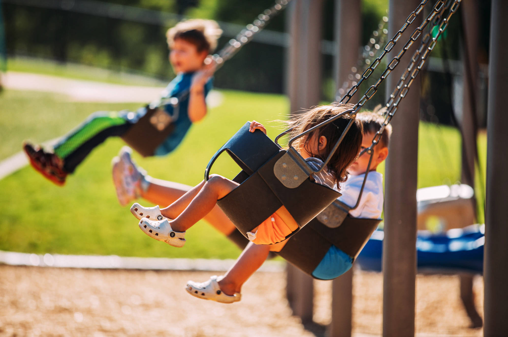Children enjoy the swings at the grand opening Aug. 11 of the renovated West Fenwick Park in Kent. COURTESY PHOTO, City of Kent