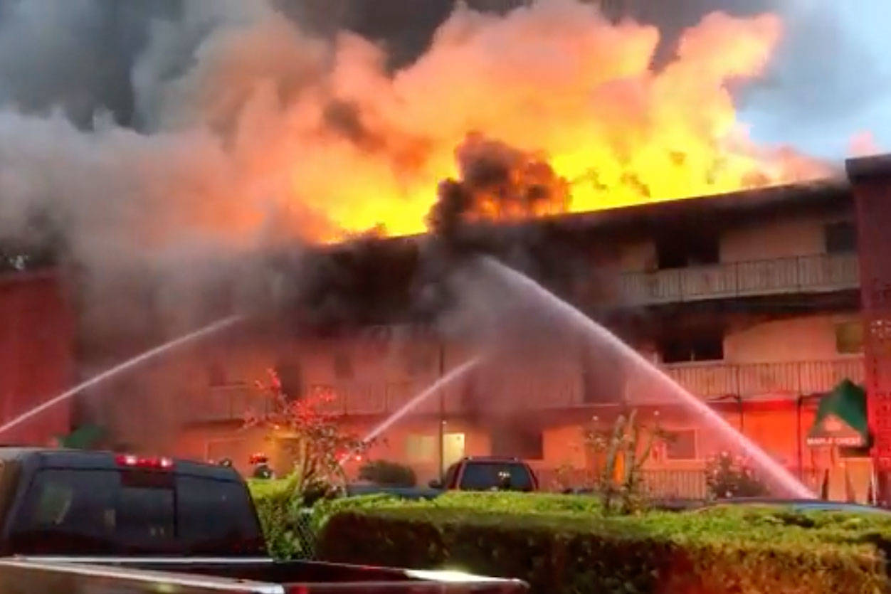 A three-alarm fire at a Tukwila apartment complex Aug. 17 killed three people. (screenshot from video posted by ZONE3PIOs Twitter account)
