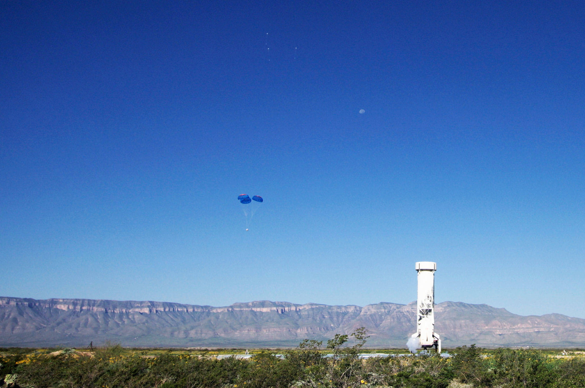 Kent-based Blue Origin’s New Shepard rocket successfully completed another flight to space and back Aug. 26 in West Texas. The booster is in the foreground and the capsule to the left of it. COURTESY PHOTO, Blue Origin