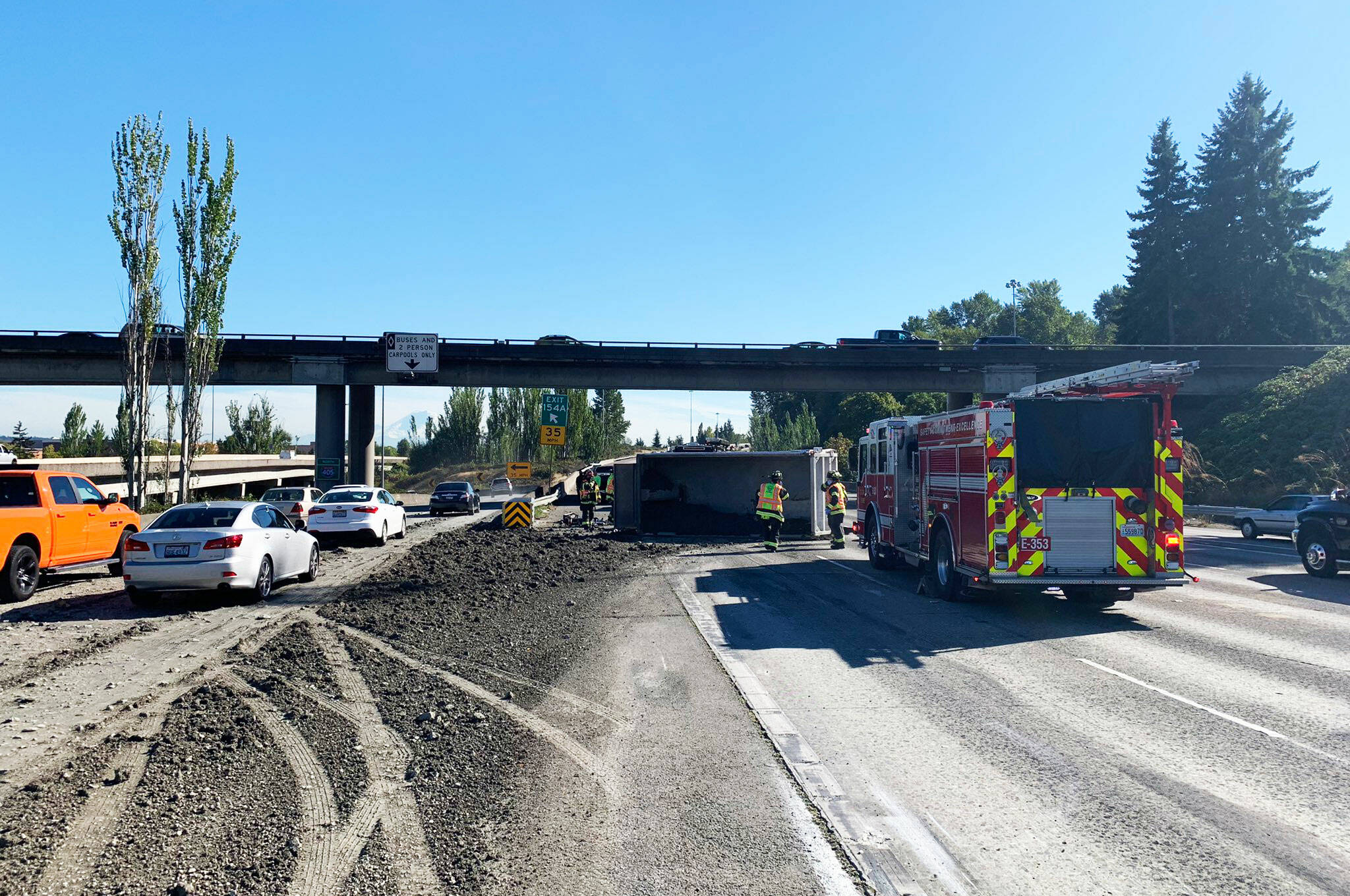 A semi flipped on its side and spilled gravel and other debris Tuesday afternoon, Sept. 21 along southbound Interstate 5 at the I-405 Renton exit. COURTESY PHOTO, State Patrol