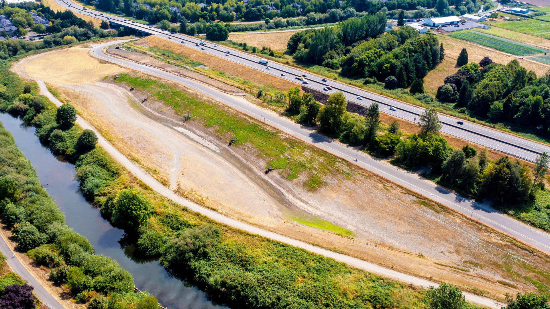 A photo from a drone of the Downey Farmstead Restoration project looking south in late summer 2021. The future fish habitat channel and flood storage area is between the Green River and State Route 516. COURTESY PHOTO, City of Kent