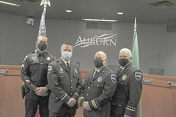 Photo courtesy of the City of Auburn
From left, Sgt. Tyson Luce, former Chief Dan O’Neil, Chief Mark Caillier, and Cmdr. Todd Byers pose for a photo during the change of command ceremony on Oct. 4. Caillier was named the new chief after O’Neil stepped down.