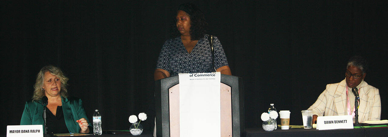 Kent Mayor Dana Ralph, left, and challenger Dawn Bennett, right, at the Kent Chamber of Commerce Mayoral Debate Oct. 7 at Heritage Club at the accesso ShoWare Center. Carmen Goers, center, moderated the debate. STEVE HUNTER, Kent Reporter