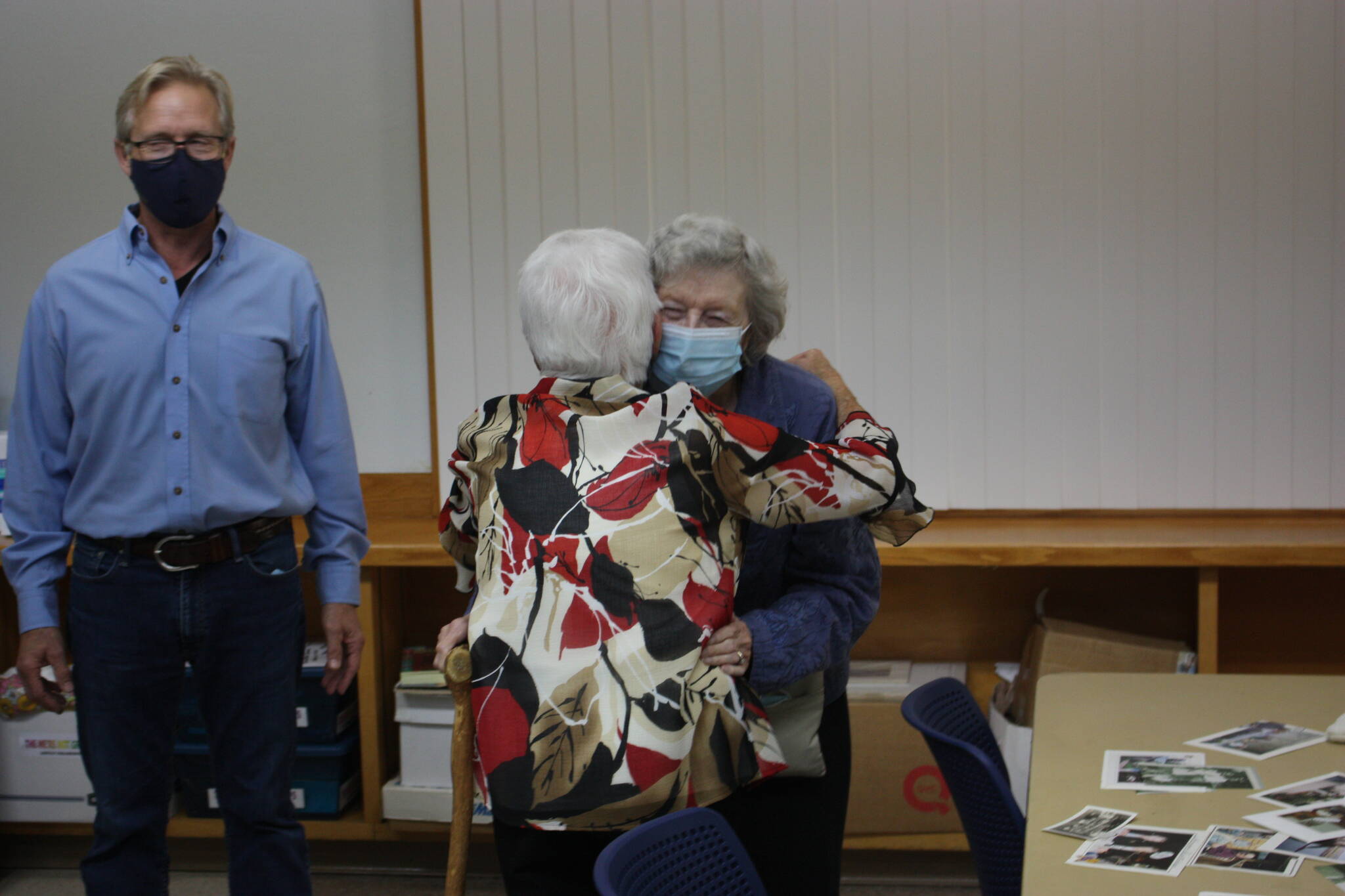 CAMERON SHEPPARD, Sound Publishing
Joan Nelson welcomes Mary Loop with a hug at the Kent High School Class of 1946 reunion Oct. 13 at the Kent Senior Center. Loop helped to found Kent Youth and Family Services.