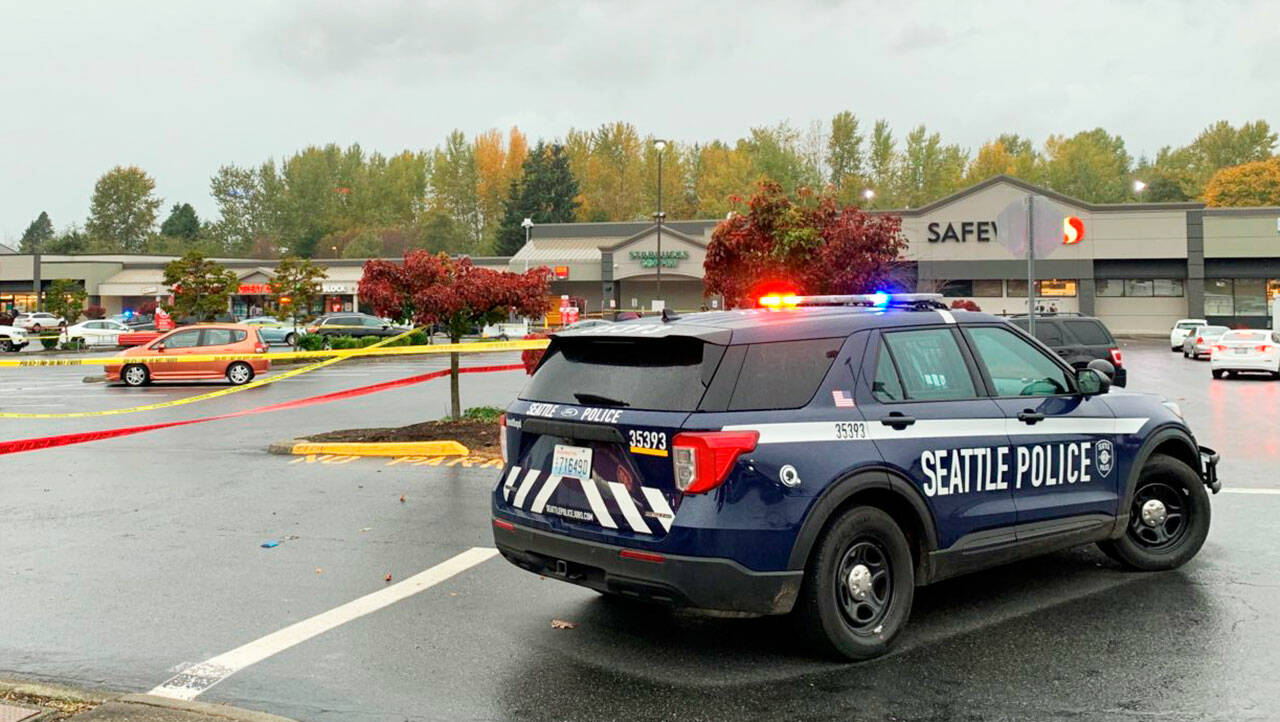 Seattle Police respond as part of a US Marshals Service task force Oct. 27 to the Safeway parking lot in Des Moines at 27035 Pacific Highway S. Officers shot and injured a man wanted for kidnapping. COURTESY PHOTO, Seattle Police