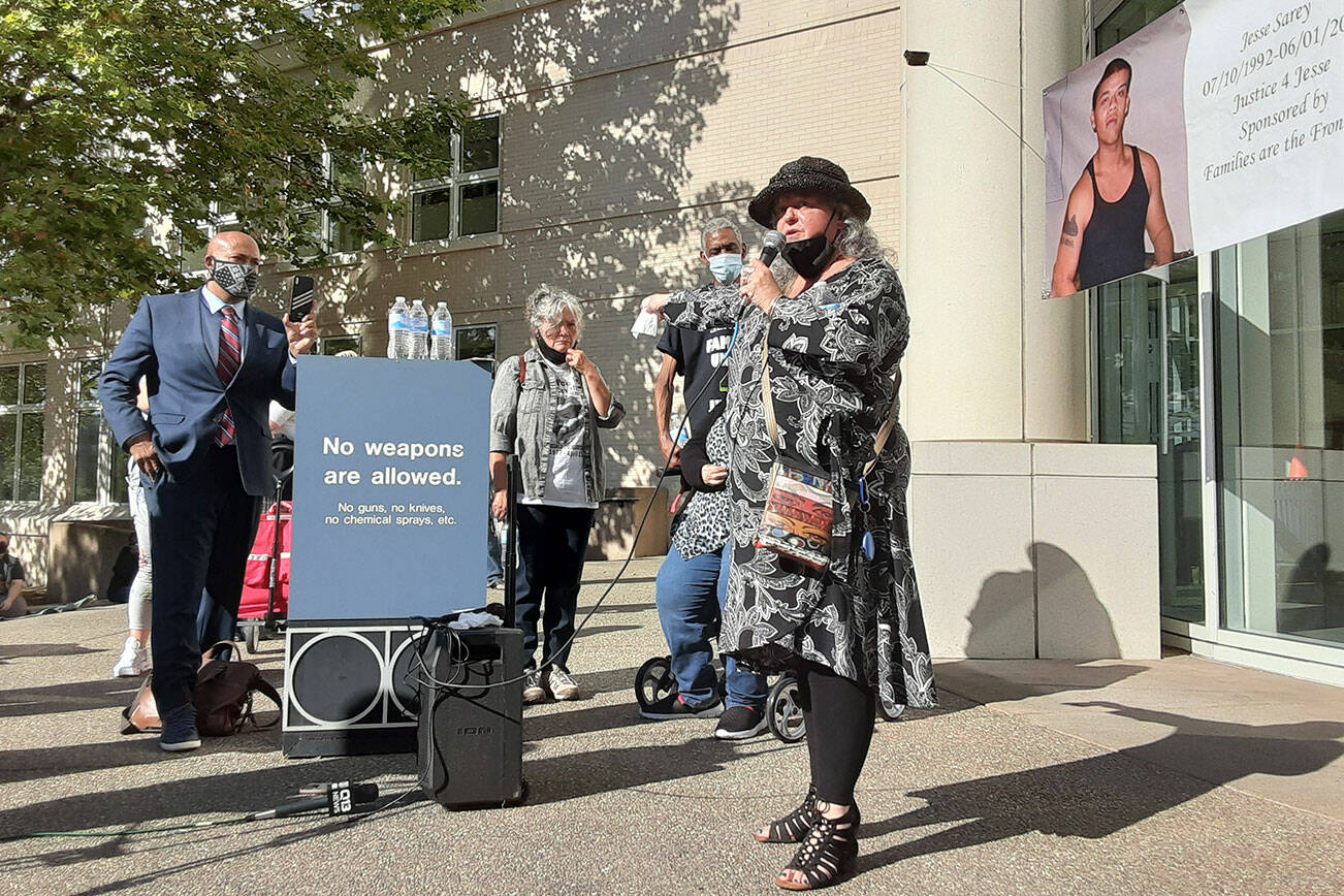 Elaine Simons, former foster mother of Jesse Sarey, addresses a crowd outside the Maleng Regional Justice Center on Aug. 24, 2020, moments after Auburn Police Officer Jeff Nelson was formally charged with second-degree murder and first-degree assault in the May 31, 2019, shooting death of 26-year-old Sarey in front of a north Auburn convenience store. File photo
