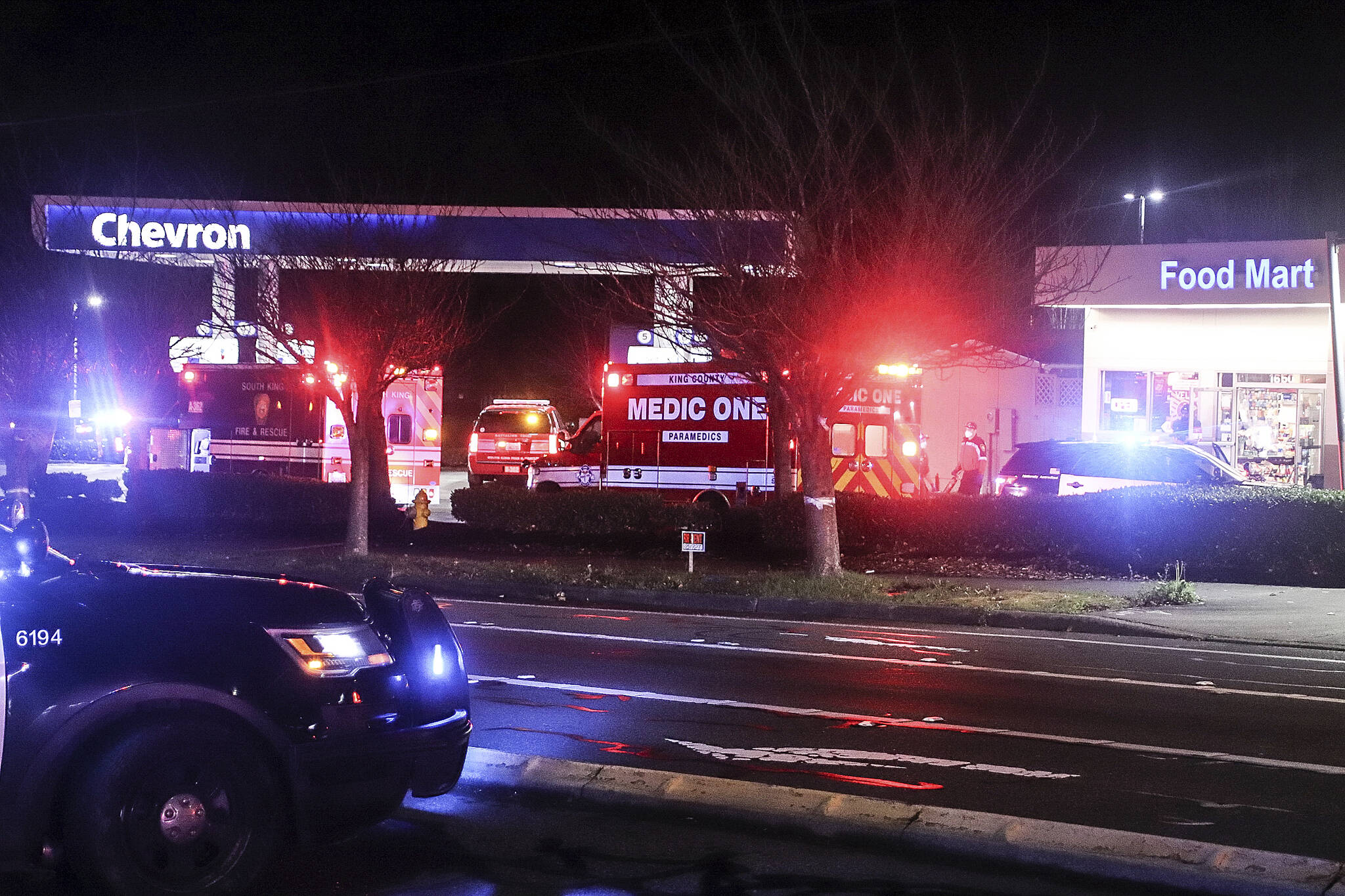 Officers and medics on scene at the Chevron gas station along SW Dash Point Road after a shooting took place on Nov. 30. Photo courtesy of PNW Thinline photography