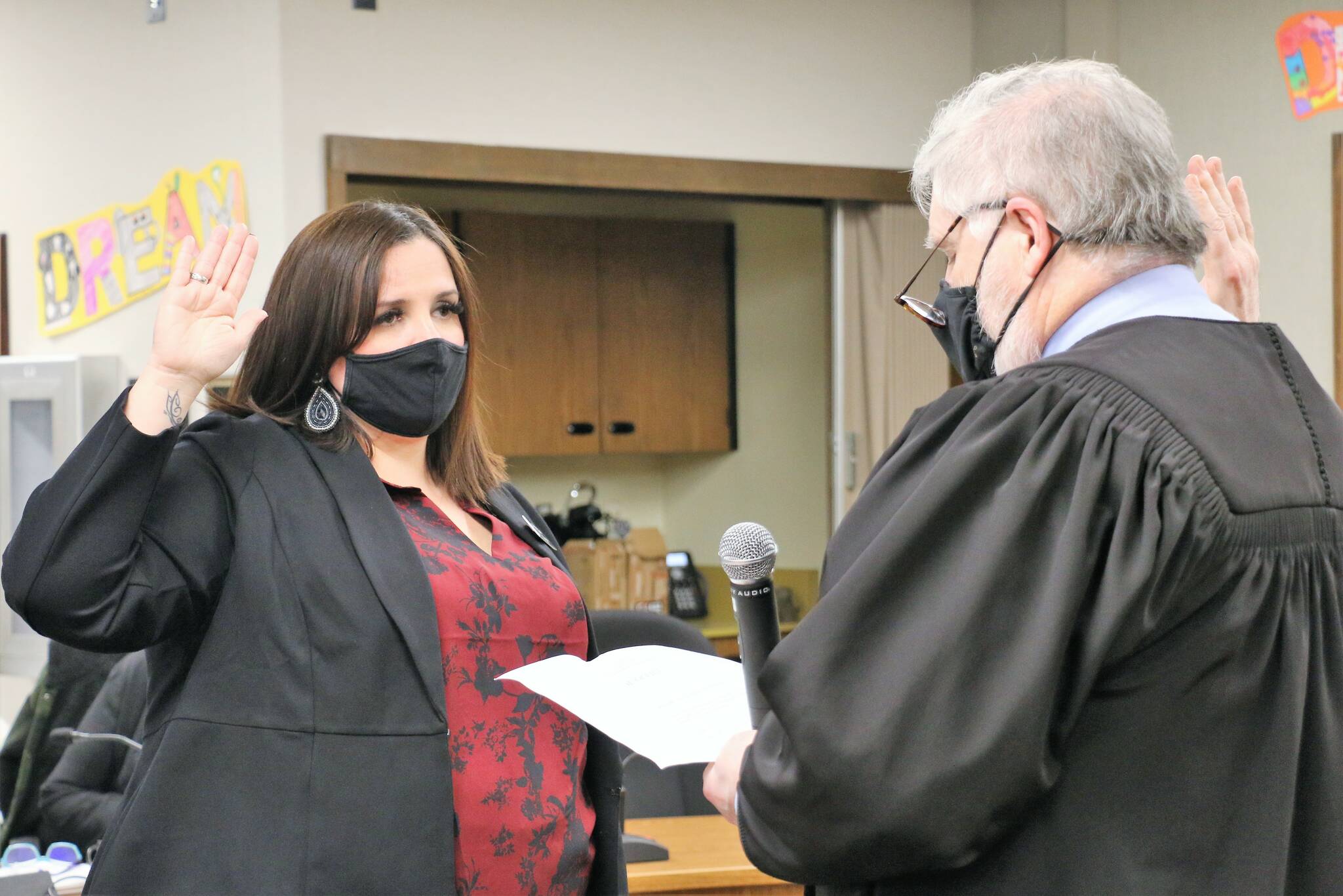 Photo Courtesy of the Auburn School District
Melissa Laramie holds up her right hand as she is sworn into the Auburn School Board by King County Superior Court Judge Matthew Williams on Dec. 13, 2021.