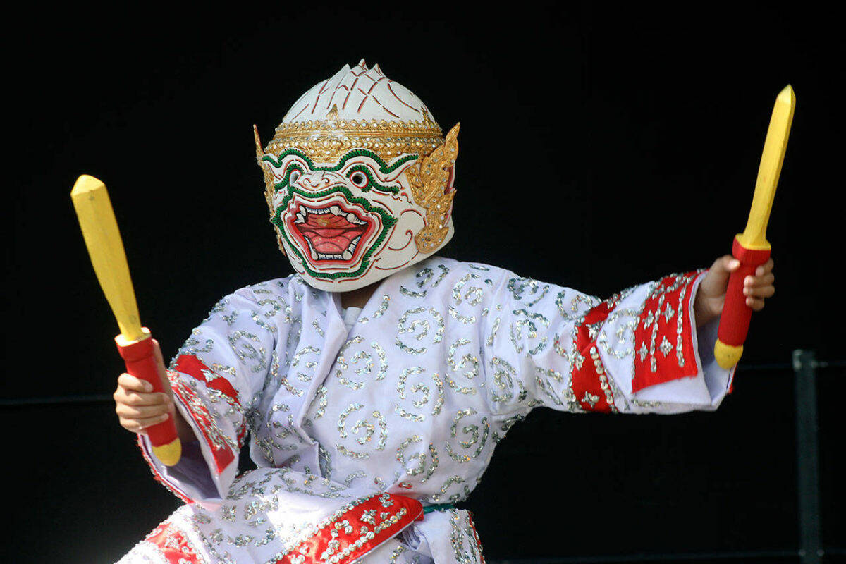Aizen Cruz of the Kinnaly Lao Traditional Music & Dance Troupe performs a Laotian dance as the Hanuman Monkey Warrior on the plaza stage outside the accesso ShoWare Center in 2019 at the Kent International Festival. FILE PHOTO, Kent Reporter
