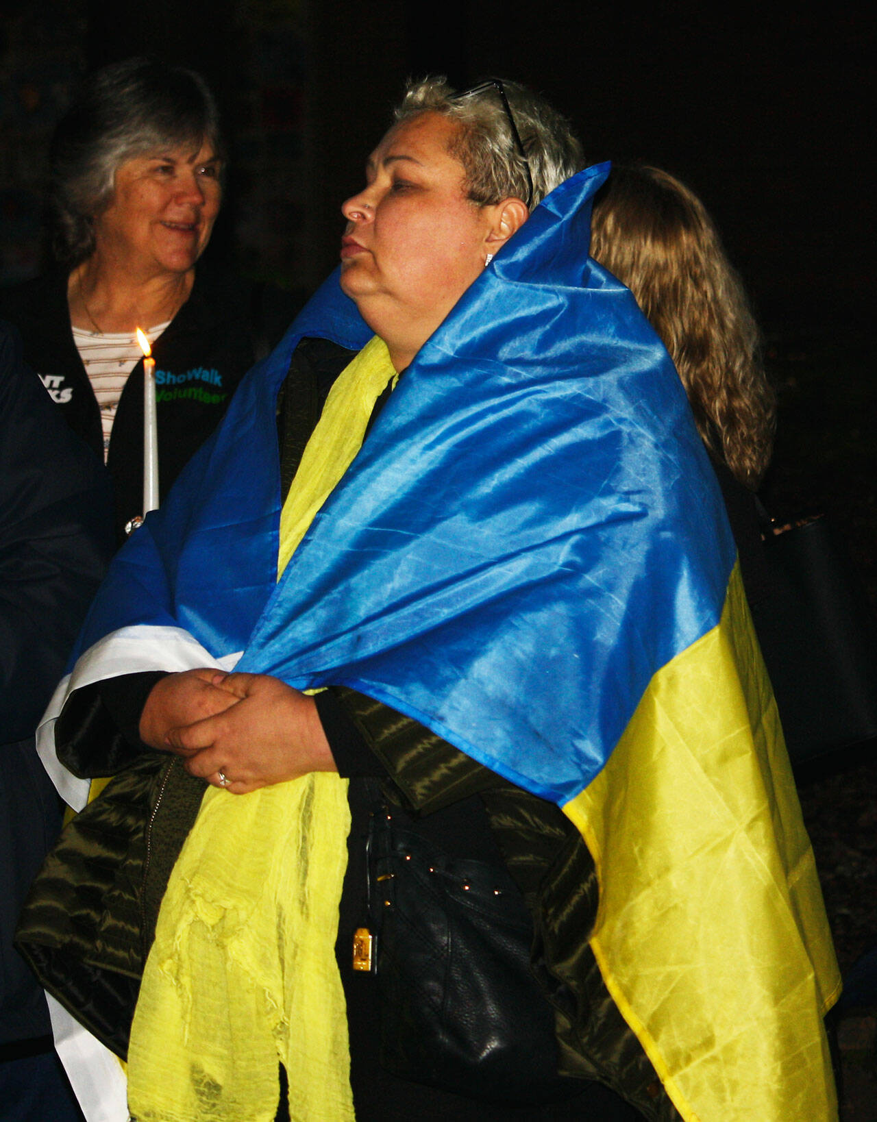 A woman wears the colors of the Ukrainian flag at the Kent City Hall courtyard on Tuesday, March 1 as part of an Unity for Ukraine rally. STEVE HUNTER, Kent Reporter