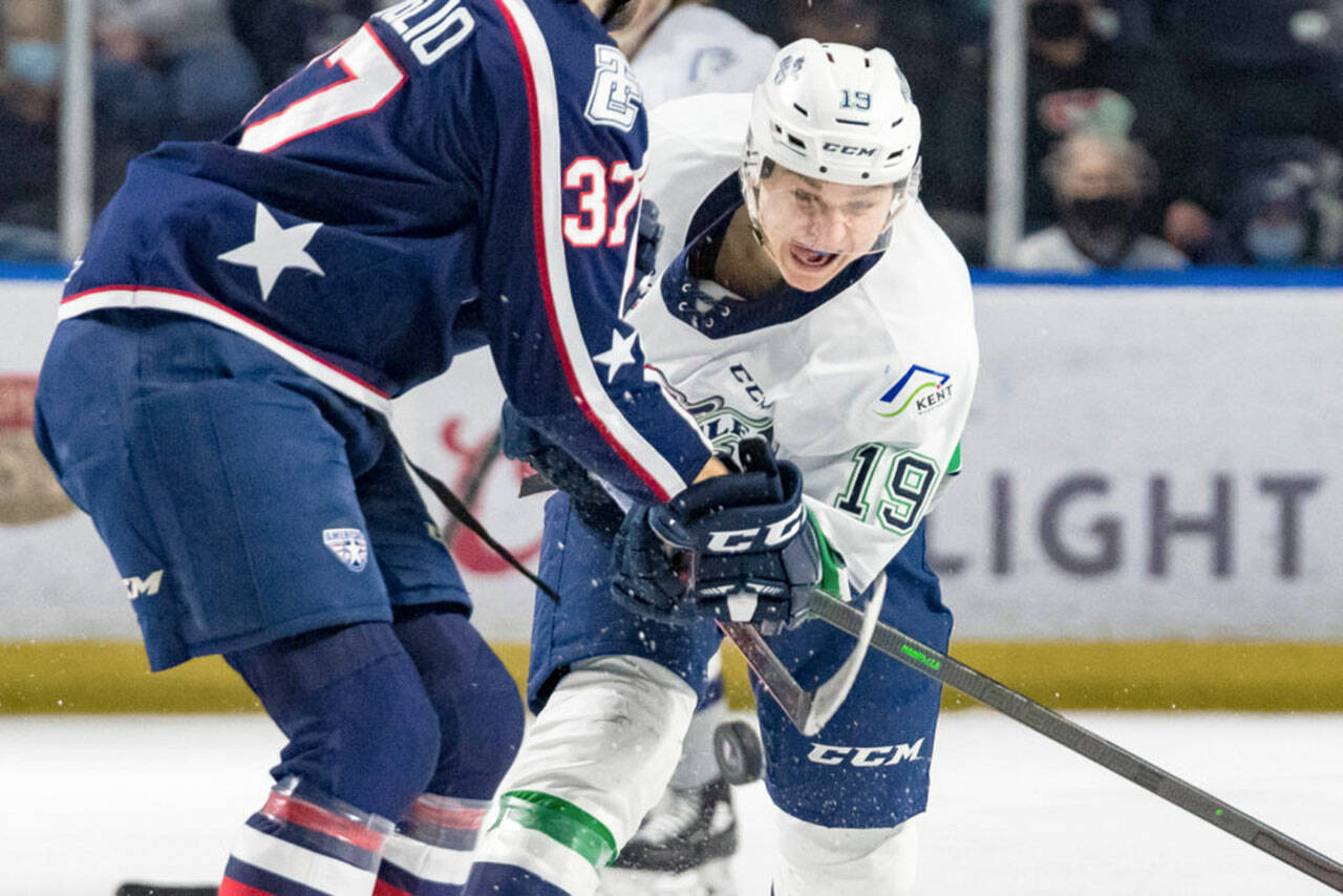 Seattle’s Sam Oremba, right, battles for the puck against Tri City’s Alex Serraglio during a March 6 game at the accesso ShoWare Center in Kent. COURTESY PHOTO, Brian Liesse, Seattle Thunderbirds