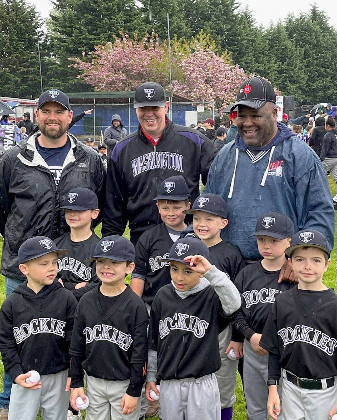 Kent City Council President Bill Boyce, far right, joins the Rockies coaches and players during Kent Little League Day April 30. COURTESY PHOTO, Puget Sound Fire