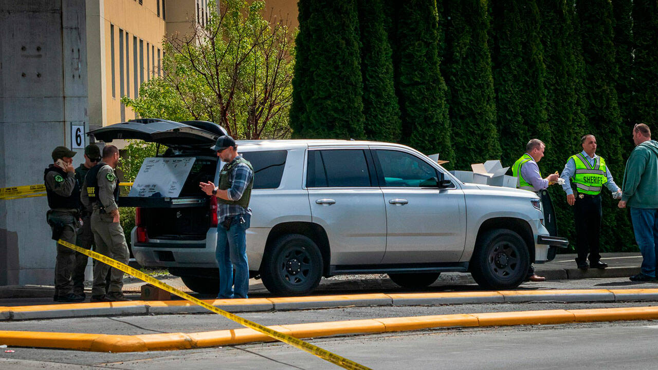 Law enforcement officials investigate the scene of a fatal shooting near a freeway ramp in Federal Way on May 4. Photo courtesy of South Sound News