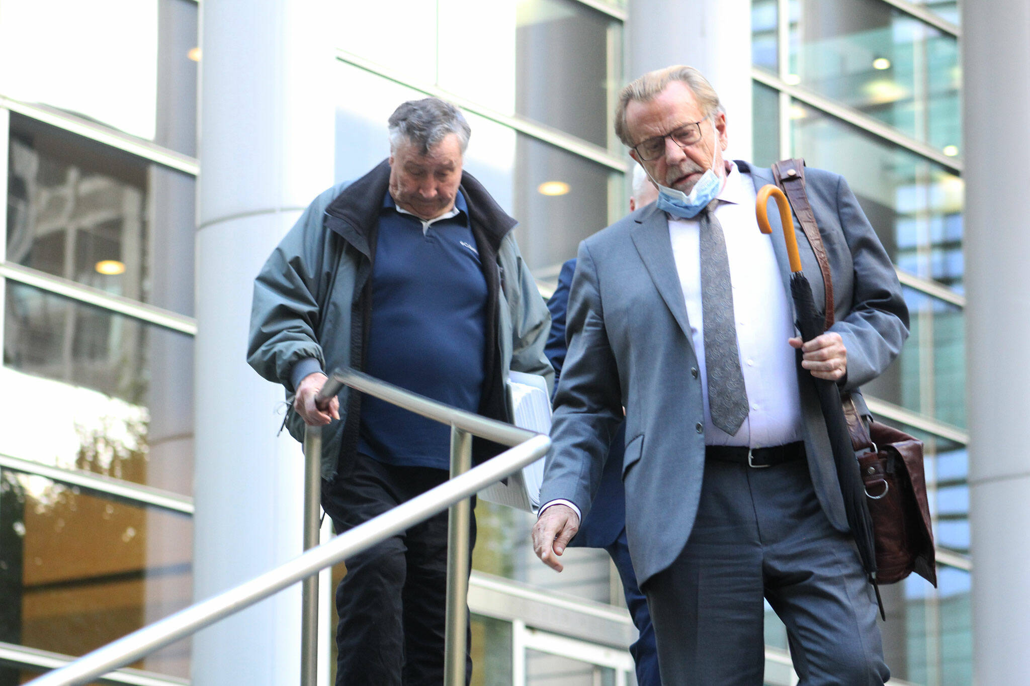 Allan Thomas and his attorney John Henry Browne exit the U.S. District Court building in Seattle following his conviction on several of the counts he was charged with in the drainage district trial. Photo by Ray Miller-Still