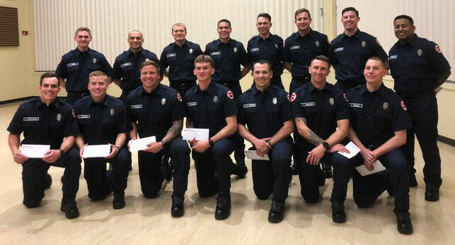 Fifteen firefighting graduates of the South King County Fire Training Consortium academy on May 19 have joined Kent-based Puget Sound Fire. COURTESY PHOTO, Puget Sound Fire