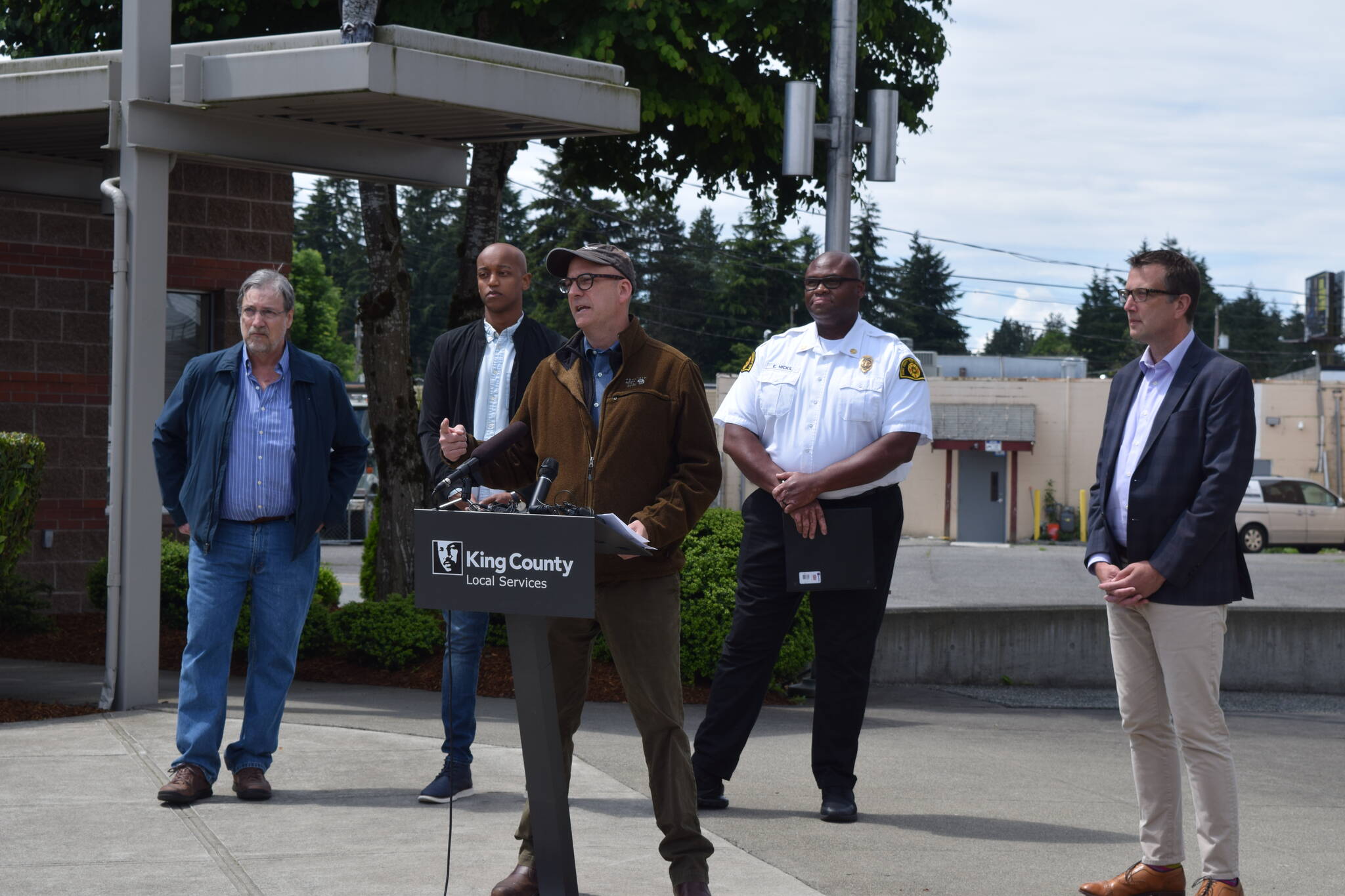 John Taylor, director of the King County Department of Local Services, speaks about the fireworks ban in Skyway on June 14. Behind Taylor (from left): King County Fire Marshal Chris Ricketts, King County Councilmember Girmay Zahilay, Skyway Fire Chief Eric Hicks and King County Councilmember Joe McDermott. Photo by Conor Wilson/Valley Record