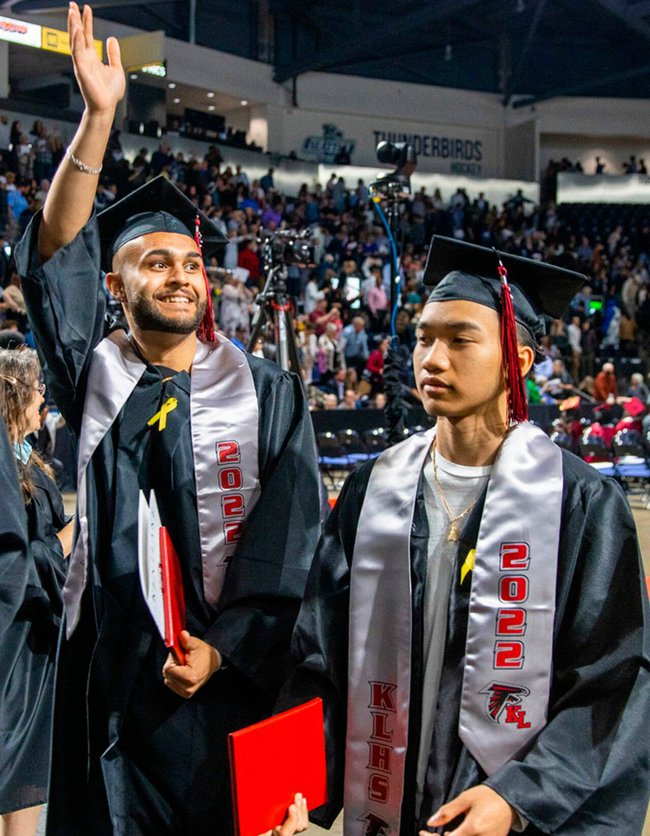 A Kentlake High School graduate waves to family and friends June 11 at the accesso ShoWare Center. COURTESY PHOTO, Kent School District