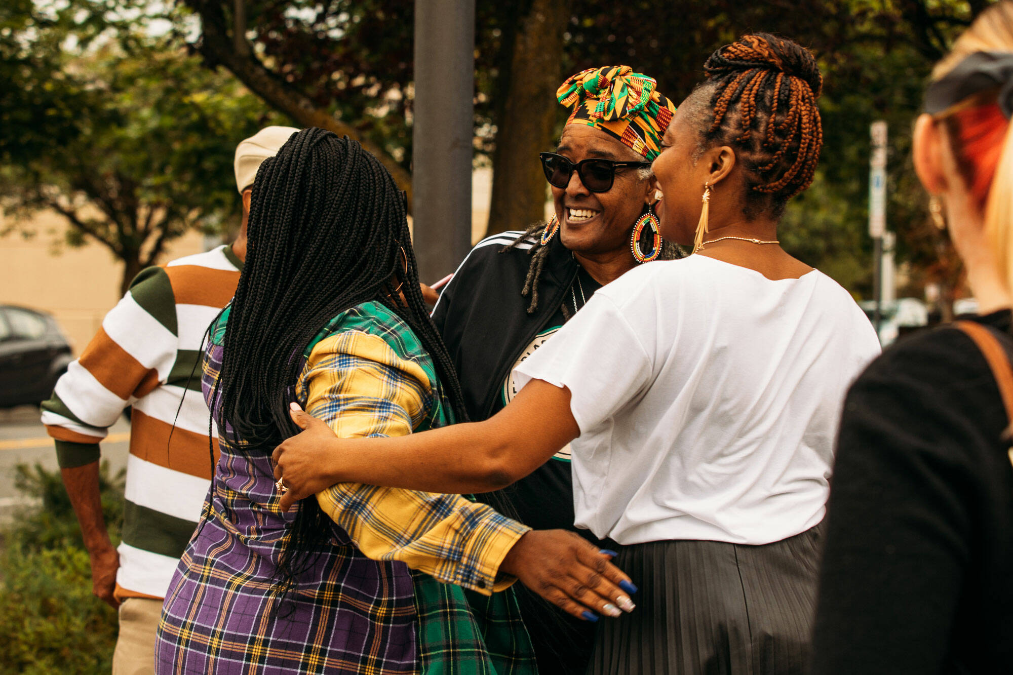 Gwen Allen-Carston, executive director of the Kent Black Action Commission, chats with two women after helping to raise the Juneteenth flag June 15 at Kent City Hall. COURTESY PHOTO, City of Kent