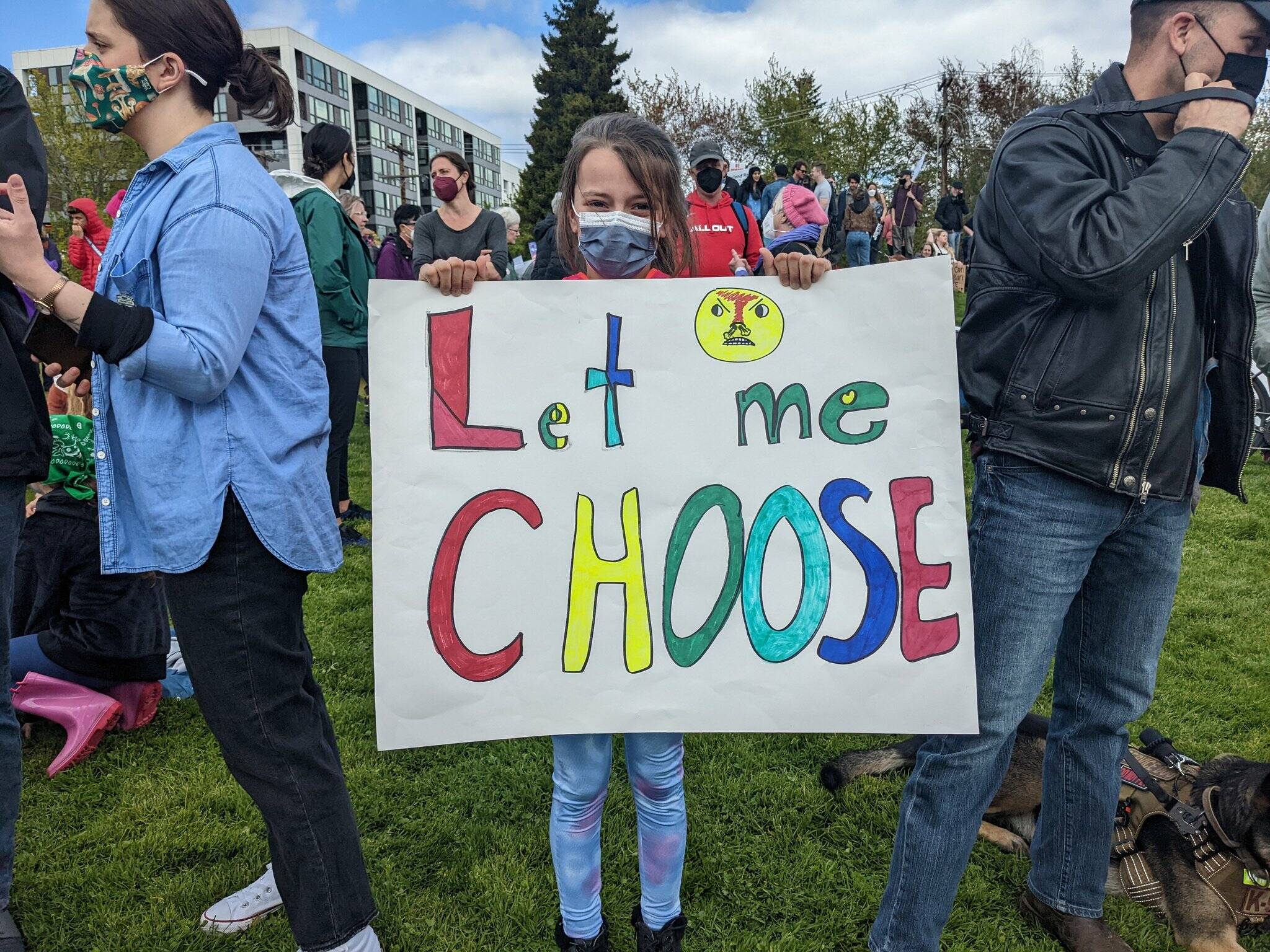 A young girl holds a sign saying “Let me choose” during a reproductive rights protest at Cal Anderson Park on May 14, 2022. Hannah Saunders/Sound Publishing