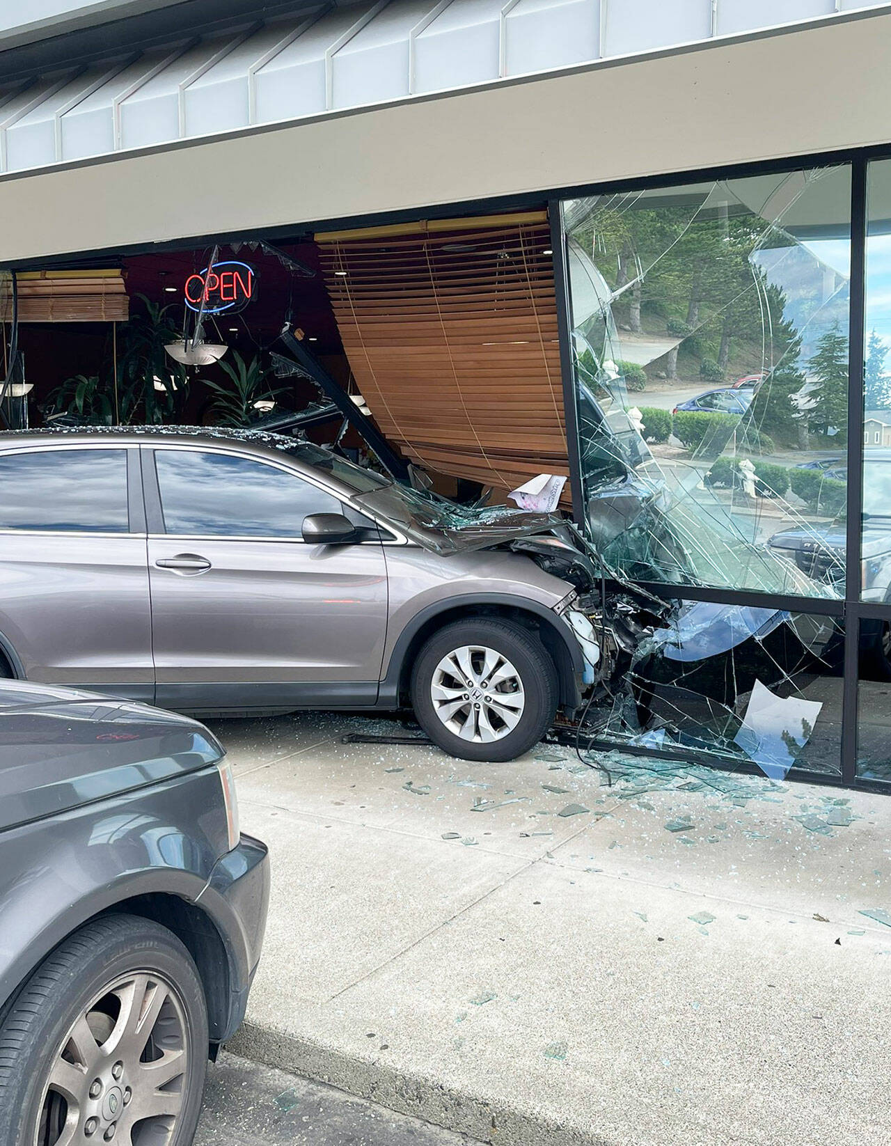 A vehicle crashed into the Pho Cat Sang restaurant, 20512 108th Ave. SE, on July 8 in Kent. Two people inside the restaurant suffered minor injuries. COURTESY PHOTO, Puget Sound Fire