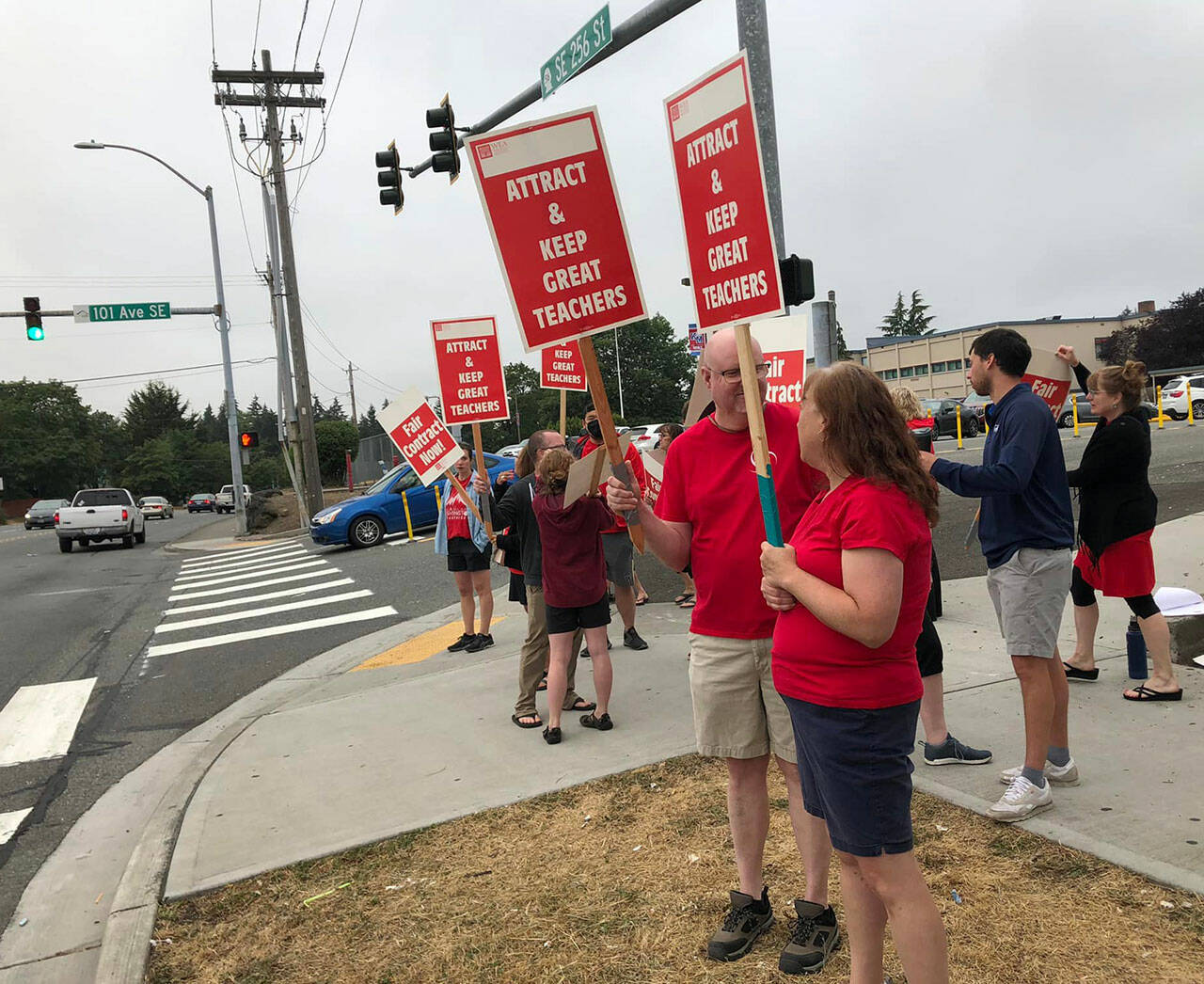 Teachers picket this week outside of Kent-Meridian High School during a Kent School District leadership meeting to spread the message that contract negotiations are not going well. COURTESY PHOTO, Kent Education Association