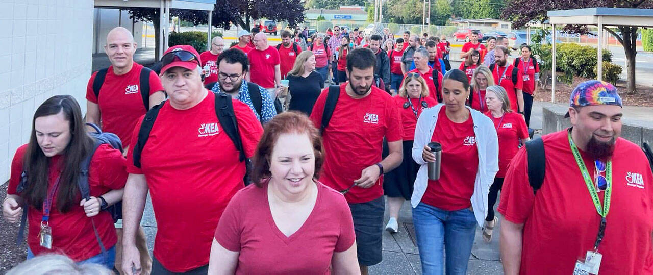 Kent teachers dressed in their red for ed shirts to help support reaching a contract agreement with the Kent School District. COURTESY PHOTO, KEA