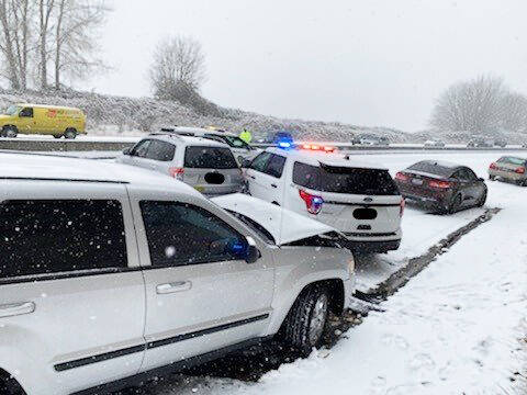 A vehicle collided with a State Patrol SUV, third from right, while it was at the scene of a minor crash Tuesday morning, Nov. 29 along State Route 516 in Kent near Military Road South. Nobody was injured. COURTESY PHOTO, State Patrol