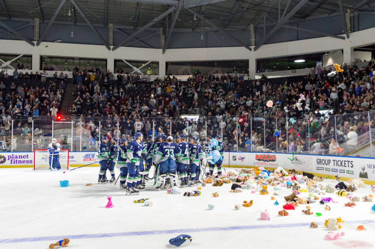 Stuffed bears cover the ice at the annual Teddy Bear Toss game of the Seattle Thunderbirds at the accesso ShoWare Center. COURTESY PHOTO, Brian Liesse