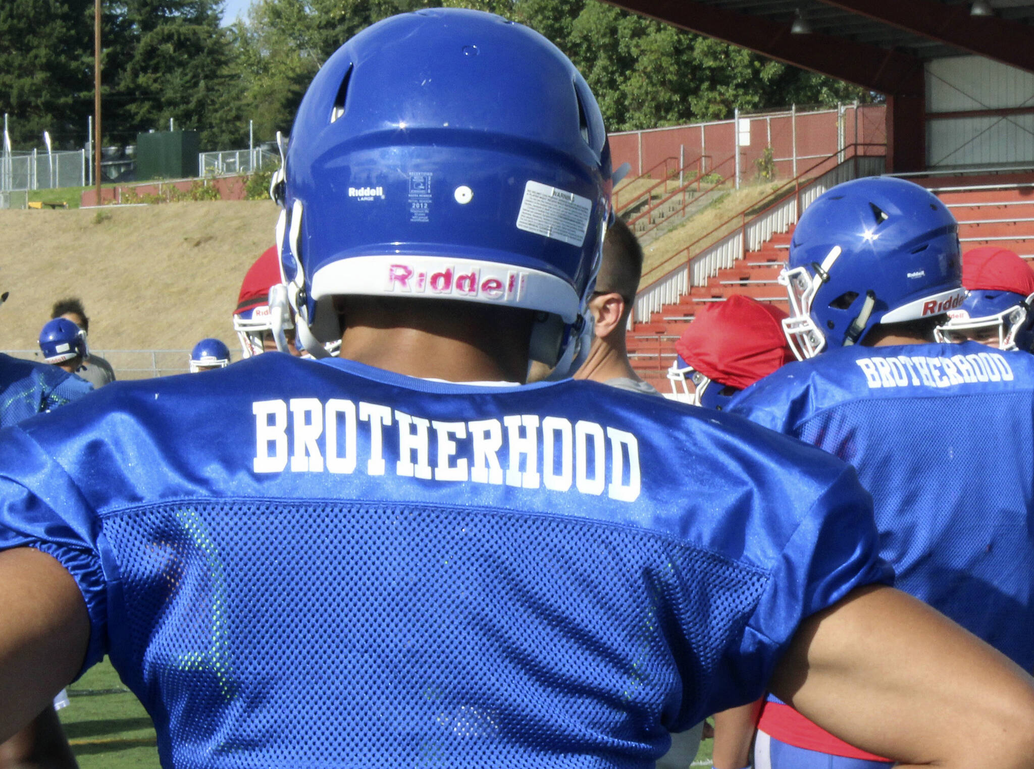 The Federal Way High School football team wears practice jerseys with the word “brotherhood” on the back to honor former teammate Allen Harris. File Photo by Olivia Sullivan, Sound Publishing