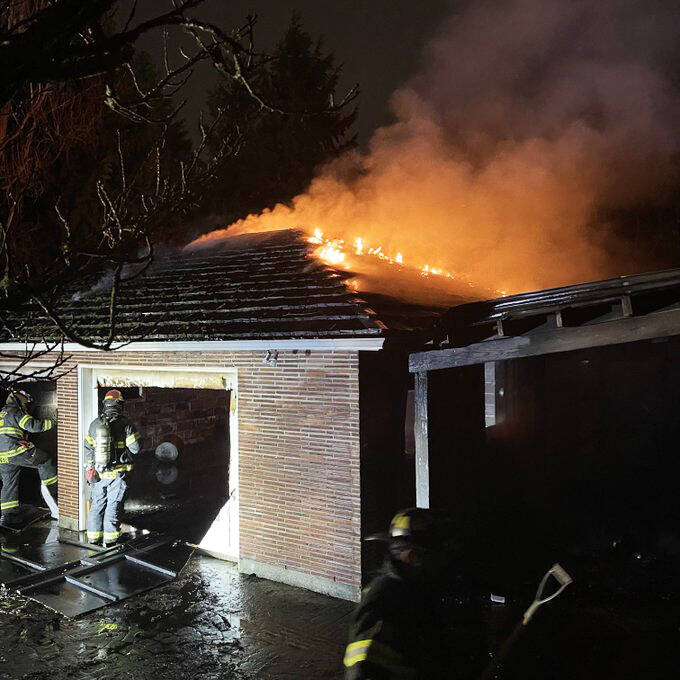 Puget Sound Fire firefighters battle a Kent garage blaze early Thursday morning, Jan. 12 in the 21500 block of 108th Avenue SE. COURTESY PHOTO, Puget Sound Fire
