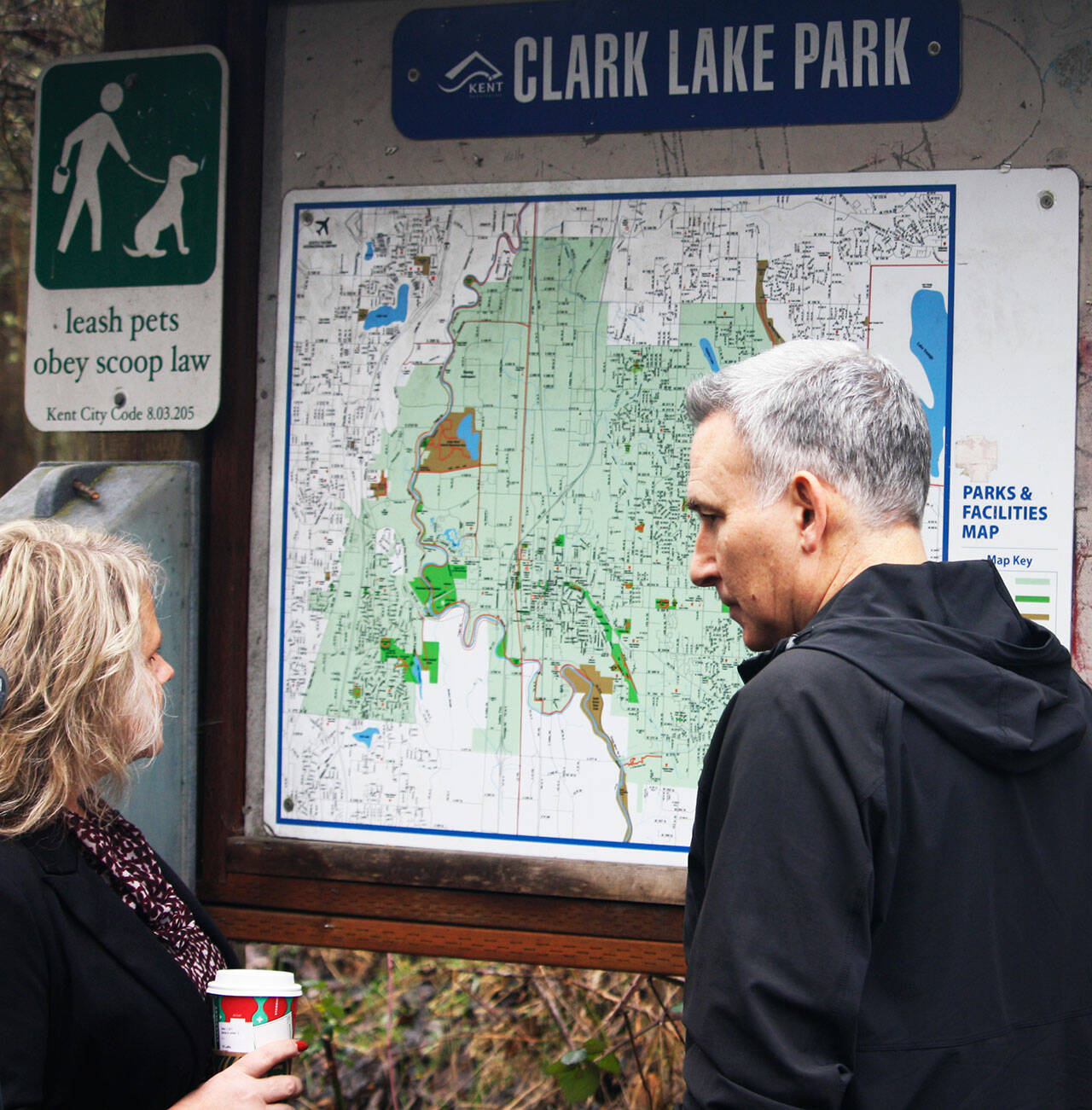 Kent Mayor Dana Ralph and King County Executive Dow Constantine check out the map of Clark Lake Park in the 12500 block of SE 240th Street. STEVE HUNTER, Kent Reporter