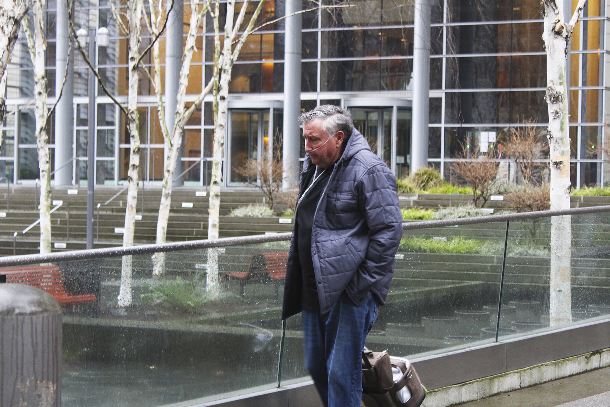 Allan Thomas, former Drainage District 5 commissioner and Enumclaw dairy farmer, walks away from the Western District of Washington federal courthouse in Seattle. He was sentenced Feb. 3 to 2.5 years in prison for his part in stealing more than $460,000 in taxes from locals. Photo by Ray Miller-Still, Sound Publishing