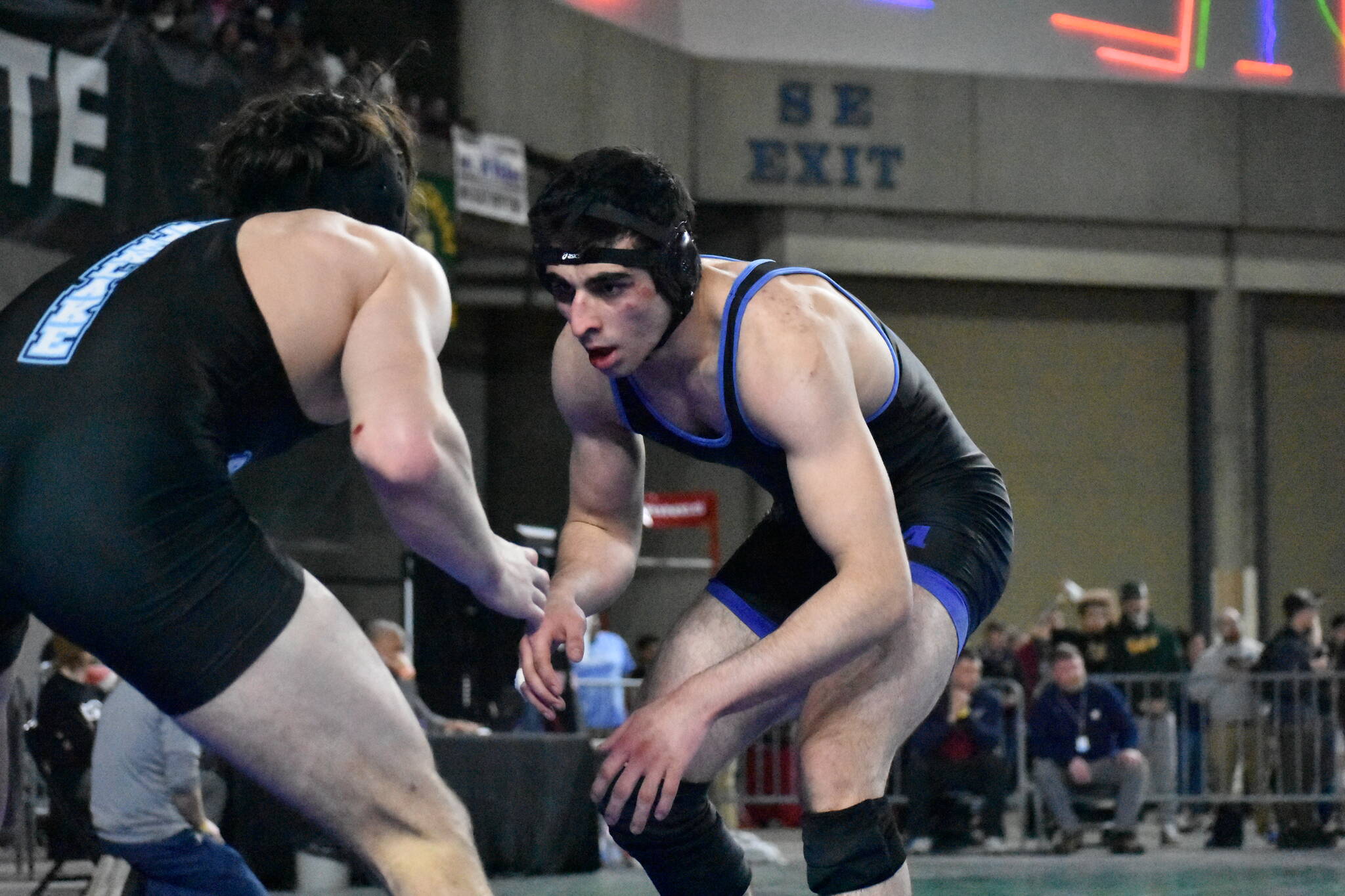 Ramazan Foldov of Kent-Meridian sizes up his opponent on the second day of the state tournament. Photos by Ben Ray/The Reporter