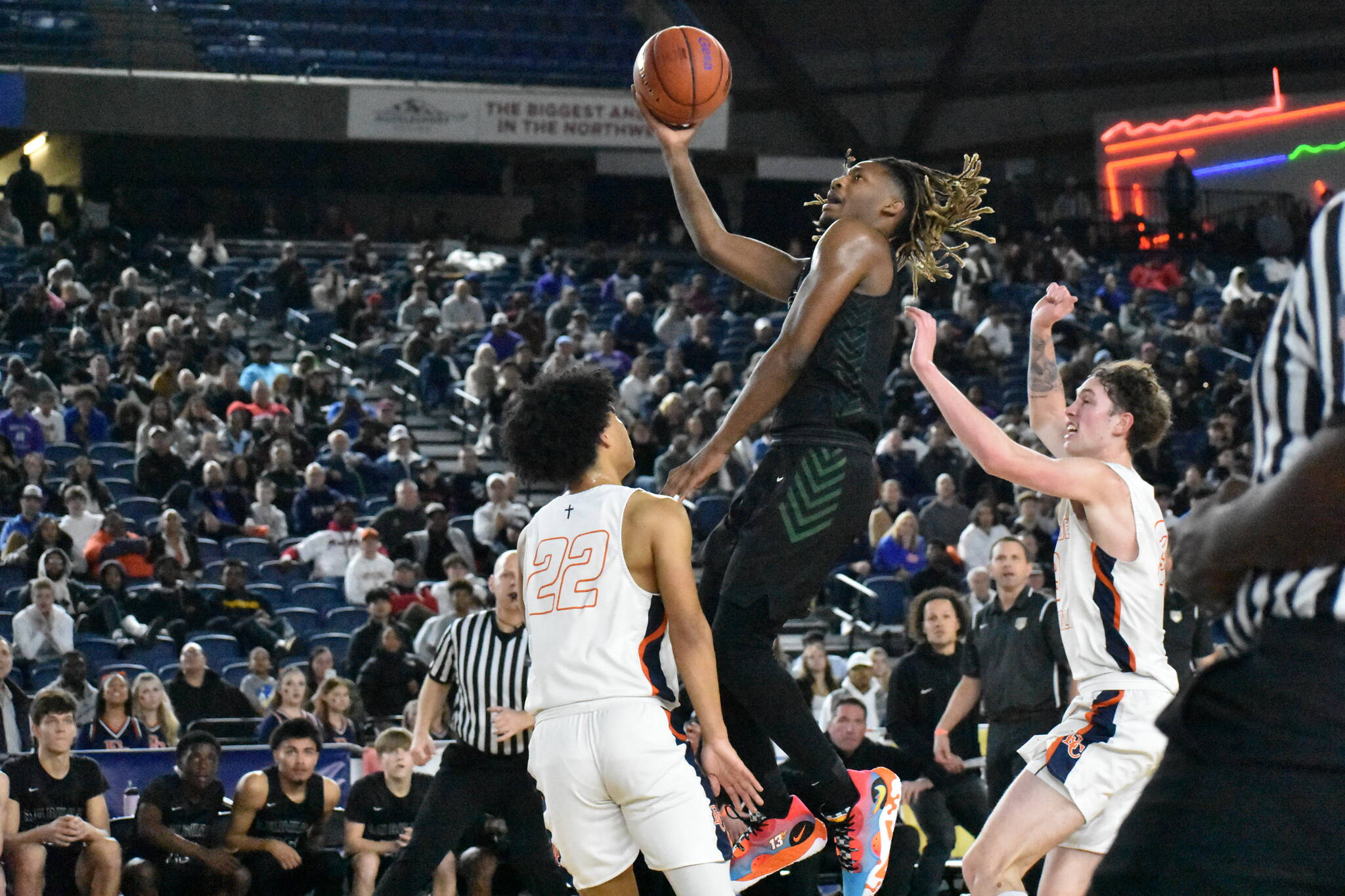 Auburn senior Lateibreon Chandler goes up for a layup inside the Tacoma Dome against Eastside Catholic. Ben Ray / The Reporter