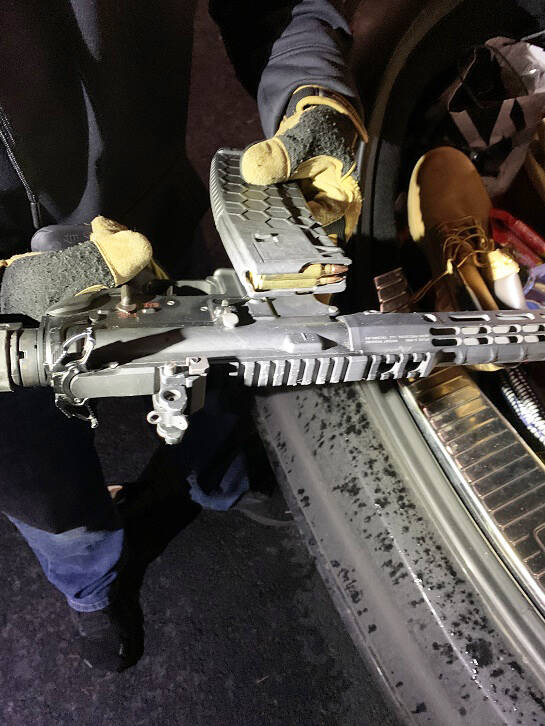 A gun found by law enforcement agencies as part of a drug ring bust in Seattle. COURTESY PHOTO,