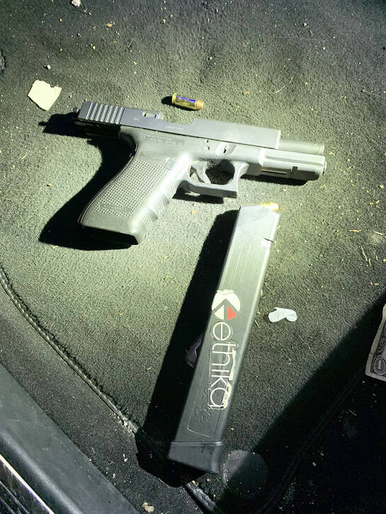 A Glock pistol found by law enforcement agencies during a drug ring bust in Seattle. COURTESY PHOTO,