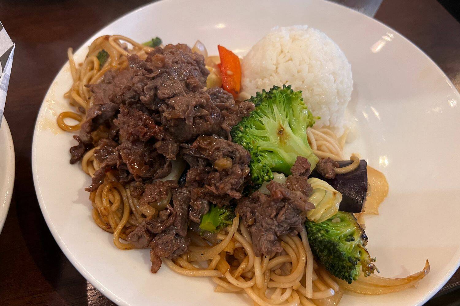 Bulgogi lunch plate special with stir-fried udon noodles and vegetables.