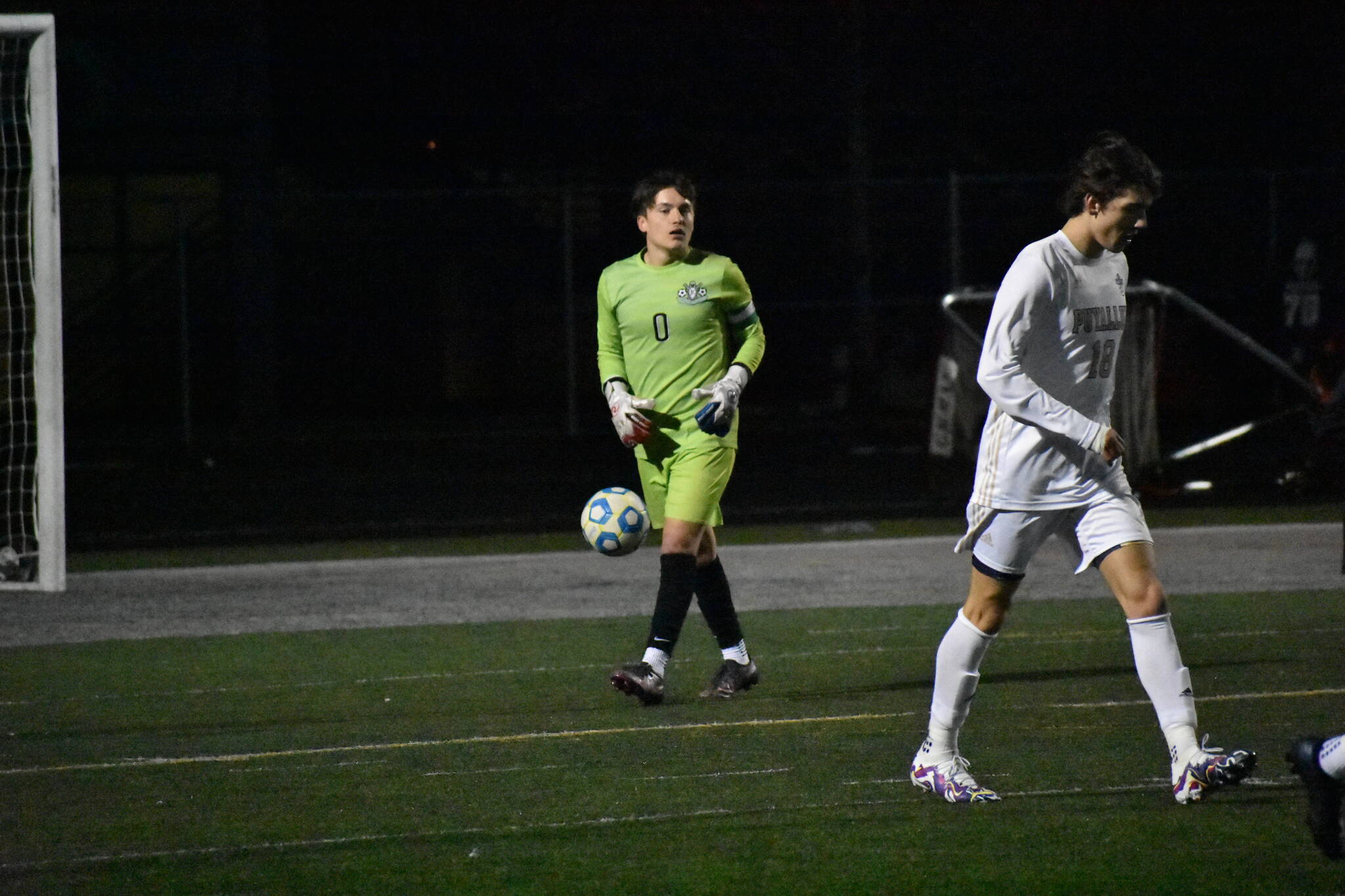 Kentwood goalie Connor Leistiko looks for teammates to start the offense. Ben Ray / The Reporter
