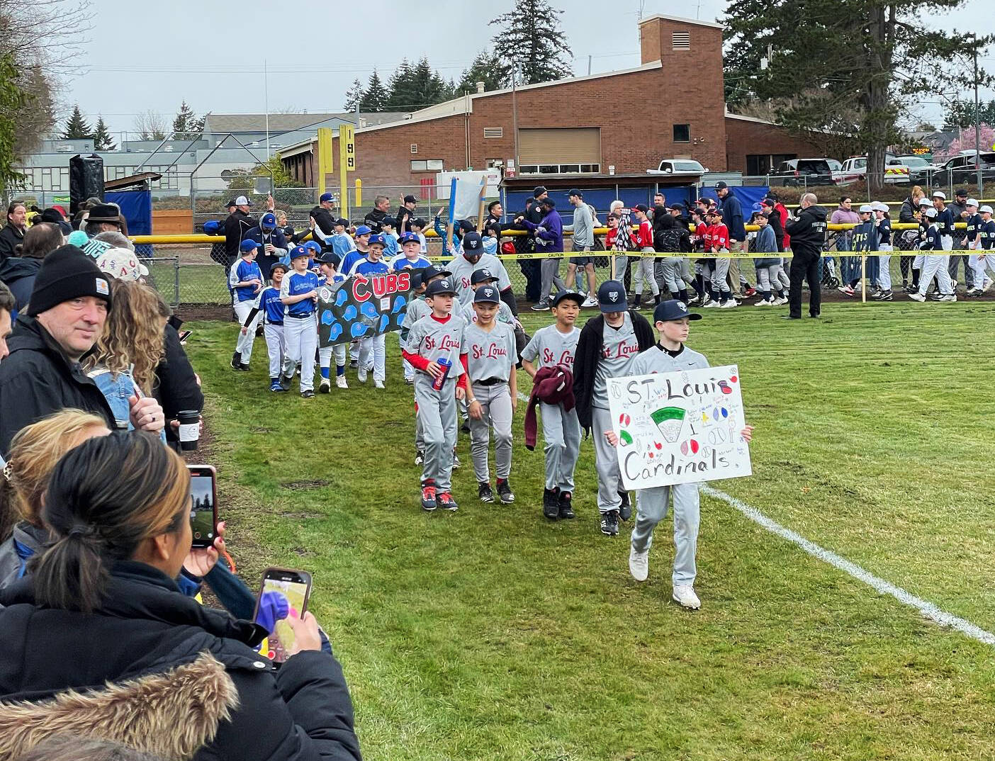 The opening day parade of Kent Little League players April 8 at Ryan Bruner Field. COURTESY PHOTO, Kent Little League