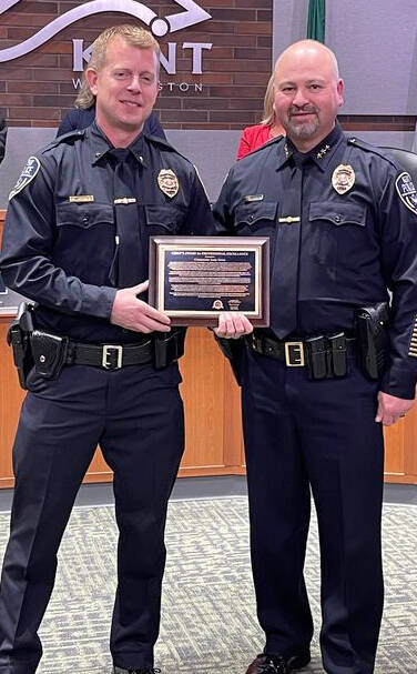 Kent Police Cmdr. Andy Grove, left, receives the Chief’s Award of Professional Excellence from Chief Rafael Padilla. COURTESY PHOTO, Kent Police