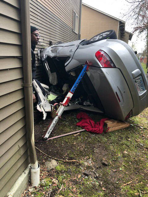Firefighters use specialized jacks to stabilize the vehicle that crashed April 13 into a Kent apartment complex. COURTESY PHOTO, Puget Sound Fire