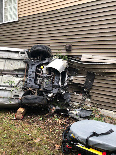 Two people inside the car were injured in the April 13 crash into a Kent apartment building at 8711 S. 259th St. Nobody was hurt inside the apartment. COURTESY PHOTO, Puget Sound Fire