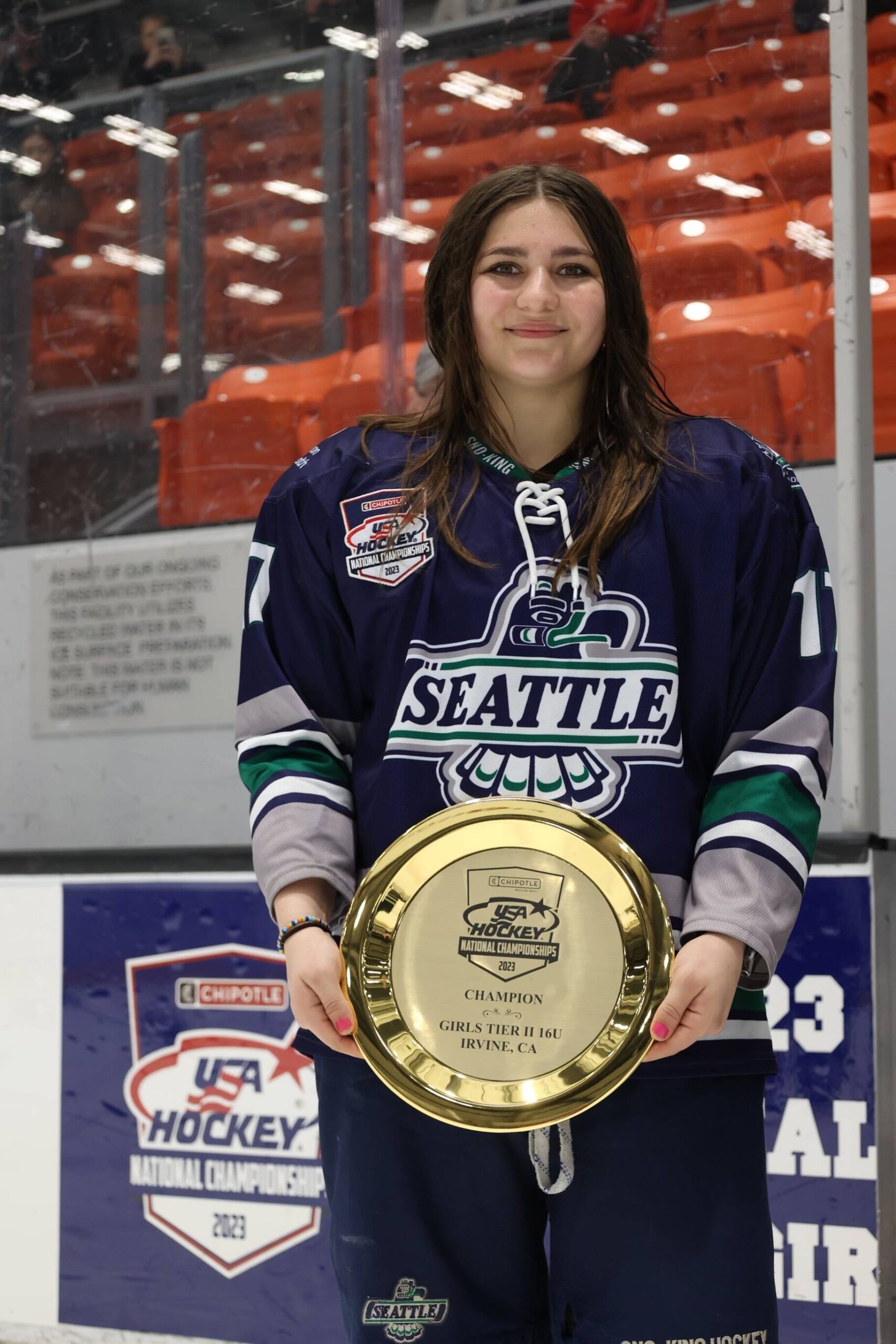 Joely Connell holds a plate at Nationals after her team became #1 in their division. Courtesy Photo, Jacqueline Connell